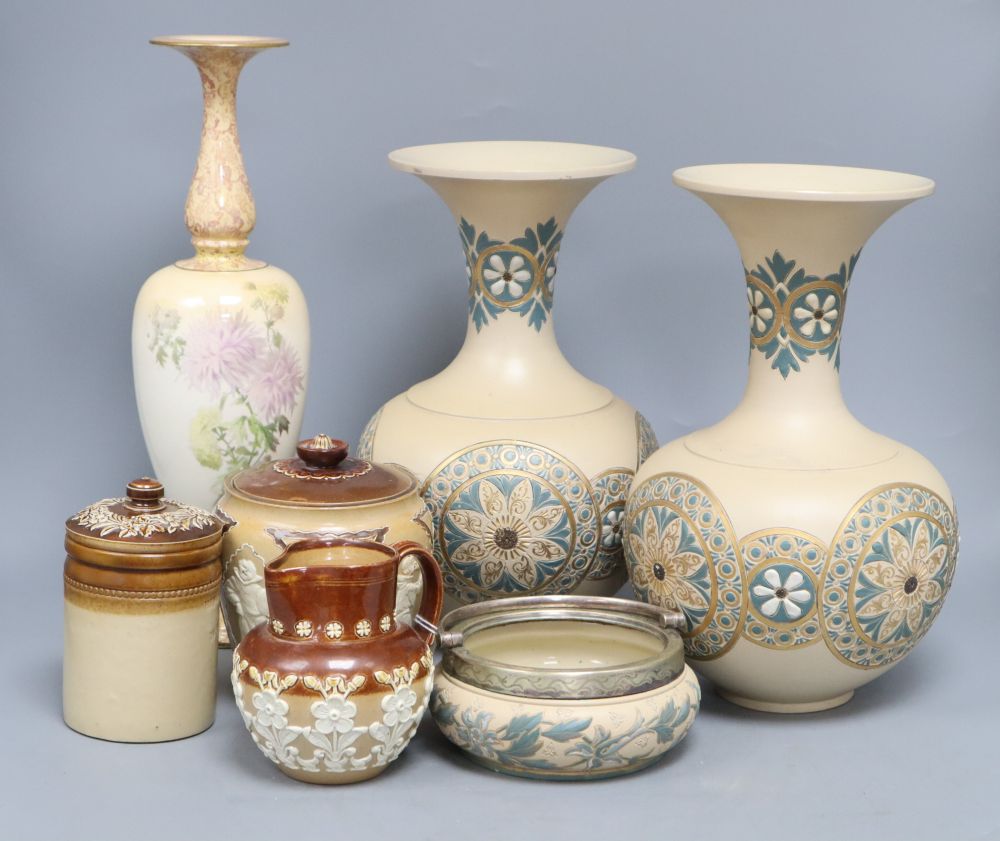 Seven pieces of Doulton stoneware including a glazed chrysanthemum vase, height 34cm